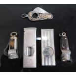 An early 20th century silver guillotine pocket cigar cutter having engine turned decoration, maker's