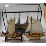A scratch-built painted wooden model of a three-masted frigate with full rigging, in glazed