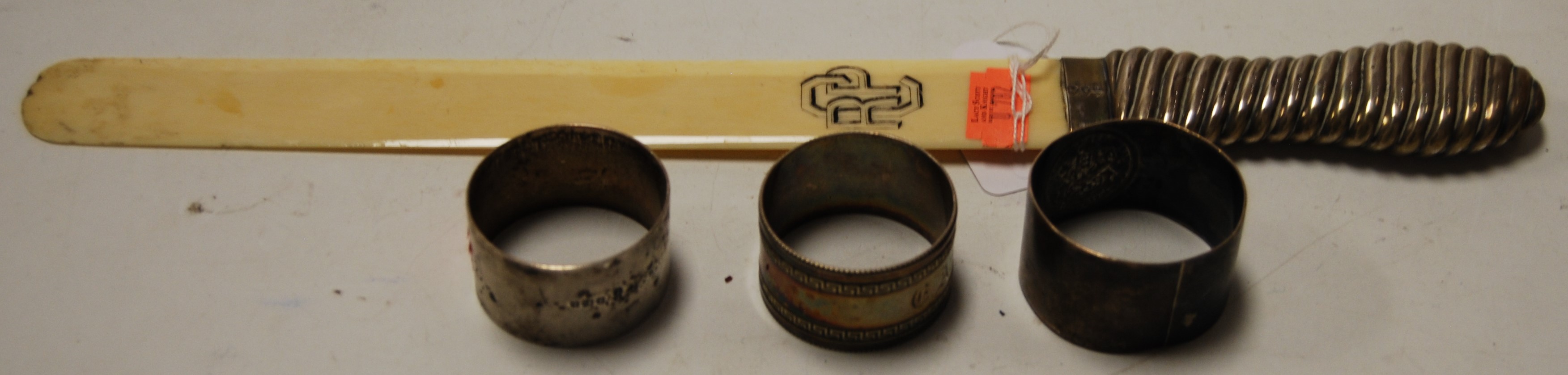 A late Victorian silver handled and ivory page turner, London 1893, together with two silver and one