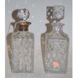 An early 20th century cut glass decanter and stopper, having silver collar; together with another