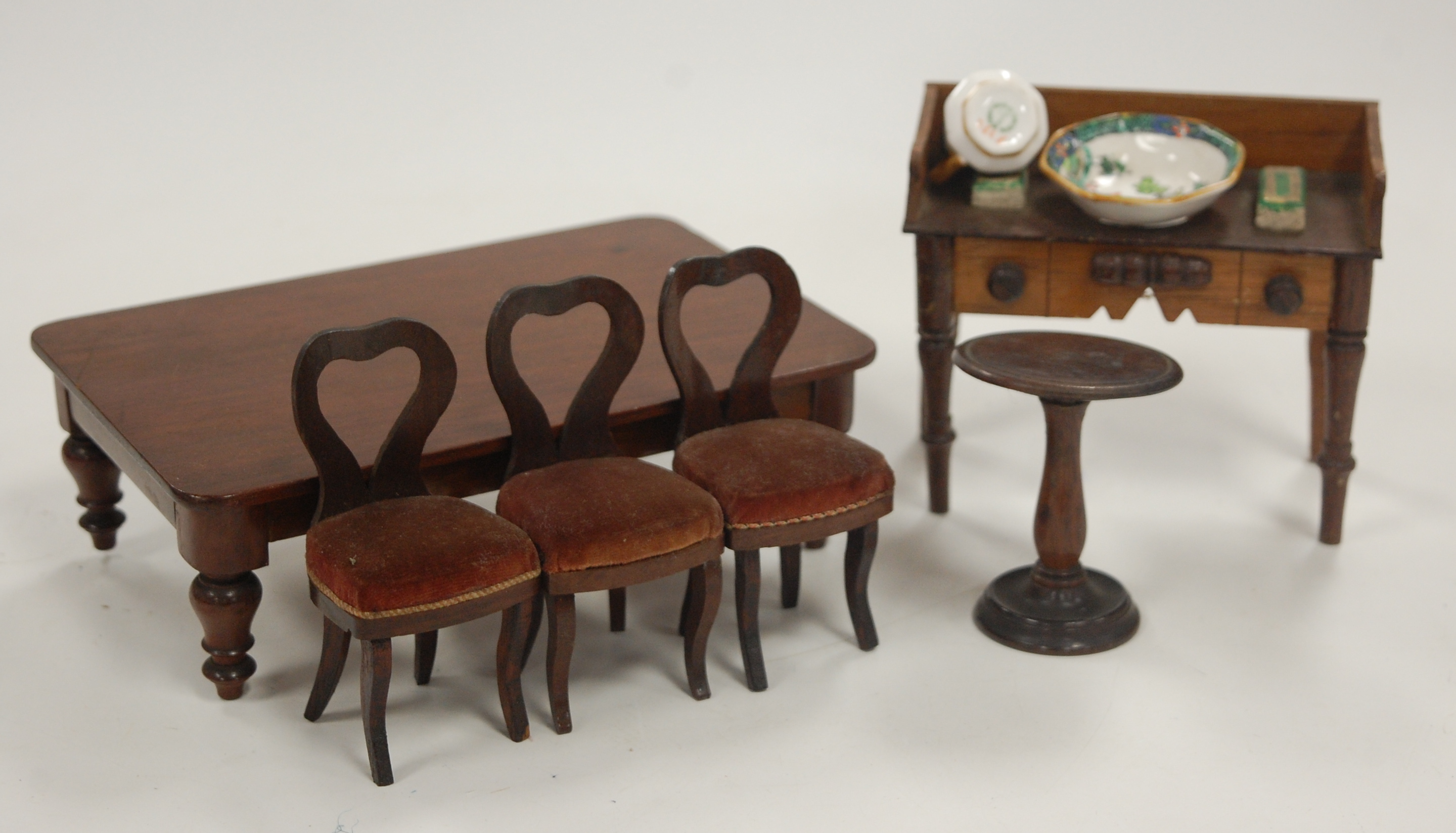 A large collection of dolls house furniture and accessories, briefly to