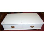A painted round cornered two drawer low coffee table, on turned supports, w.110cm