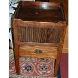An early 19th century mahgoany round cornered tray-top nightstand, having tambour door over single