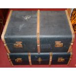 Two canvas and wooden bound travel trunks