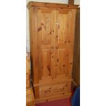 A modern pine double door wardrobe having single long lower drawer, width 89cm