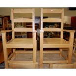 A pair of contemporary beech panelled seat ladderback elbow chairs; together with a set of six