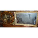 A gilt framed rectangular wall mirror together with a bevelled oval wall mirror (2)