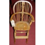An early 20th century beech child's splat back Windsor high chair