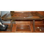 An Indonesian stained and relief carved teak low rectangular coffee table on turned tapering