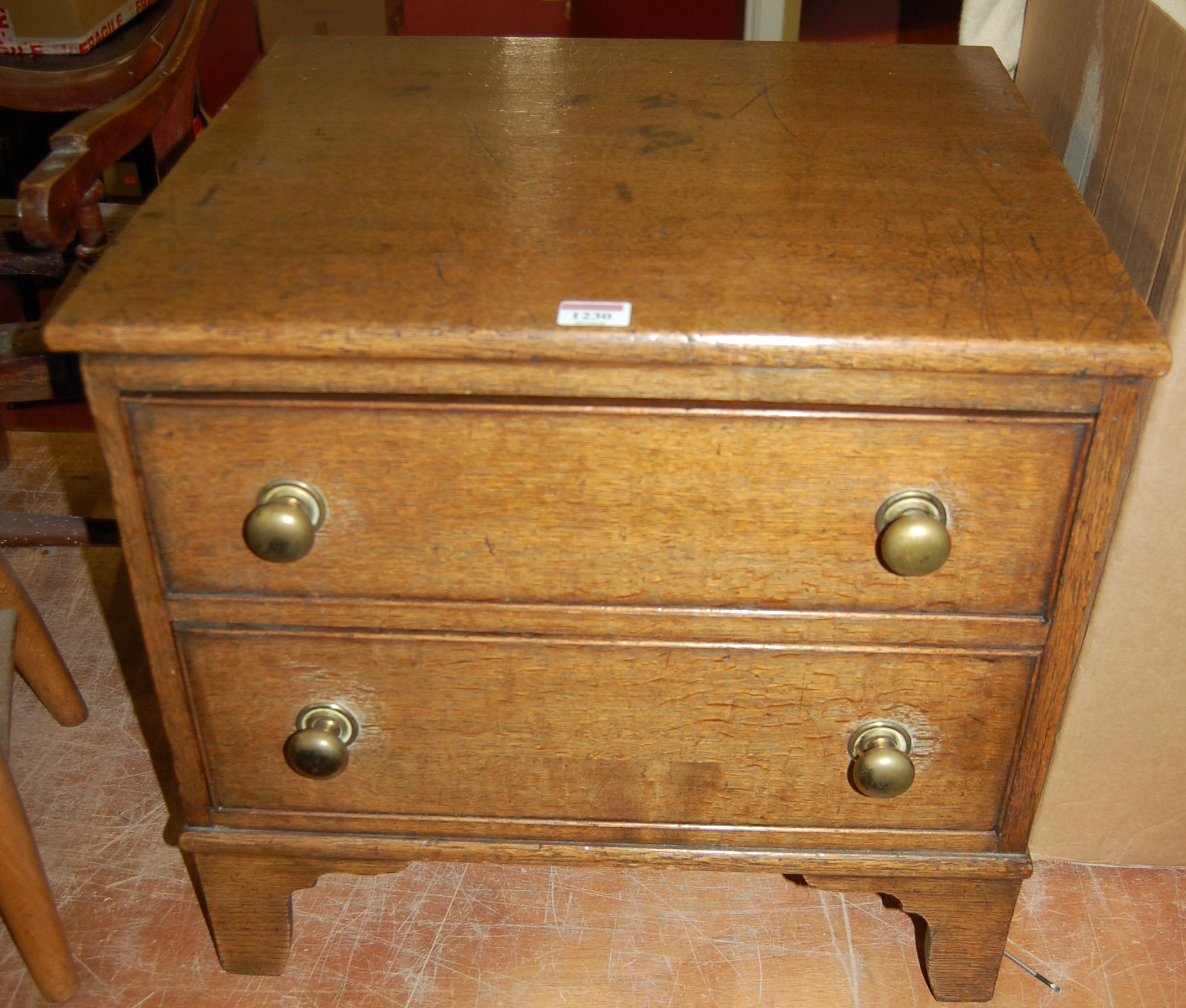 A 19th century oak table-top two-drawer chest, w.50cm