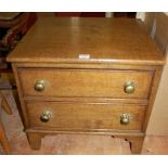 A 19th century oak table-top two-drawer chest, w.50cm