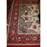 A contemporary Persian style machine woven red ground rug, 290 x 190cm