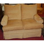 A contemporary straw coloured upholstered two-seater sofa, width 135cm