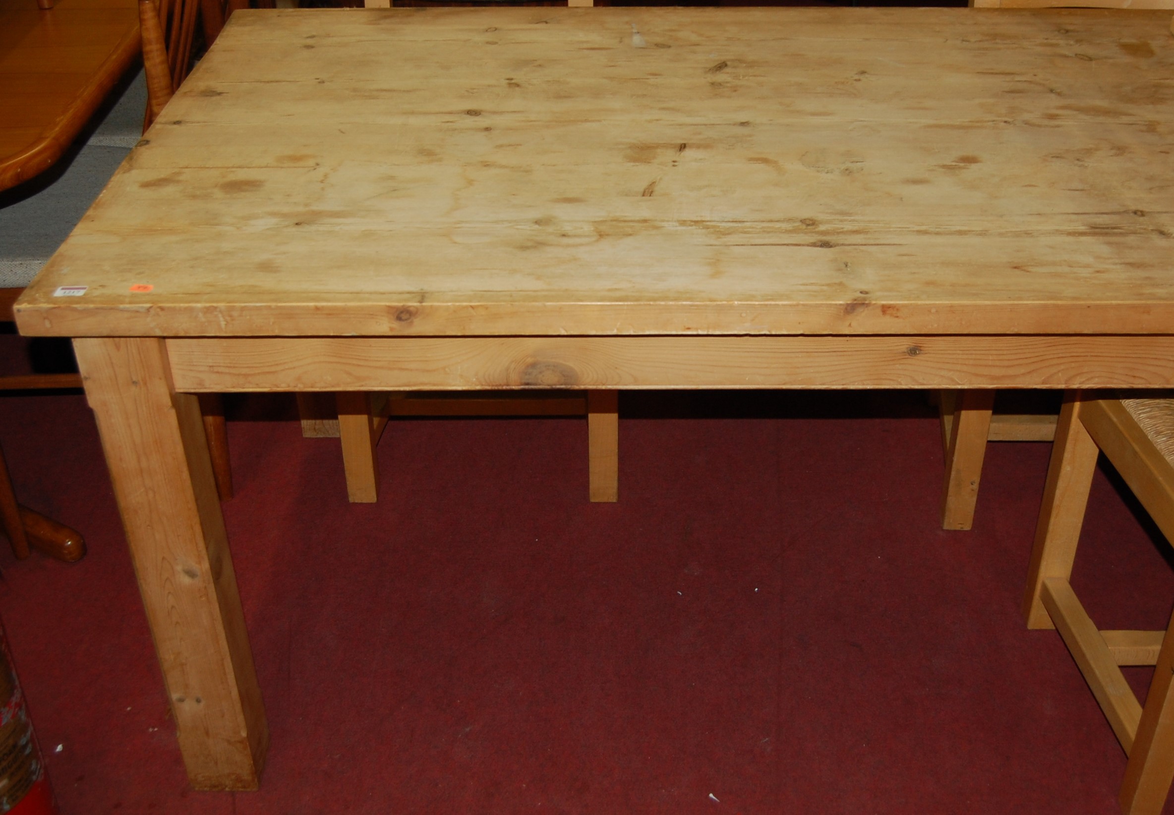 A modern pine planked top farmhouse style refectory table, raised on square supports, length 203cm