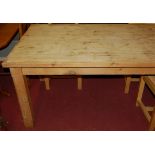 A modern pine planked top farmhouse style refectory table, raised on square supports, length 203cm