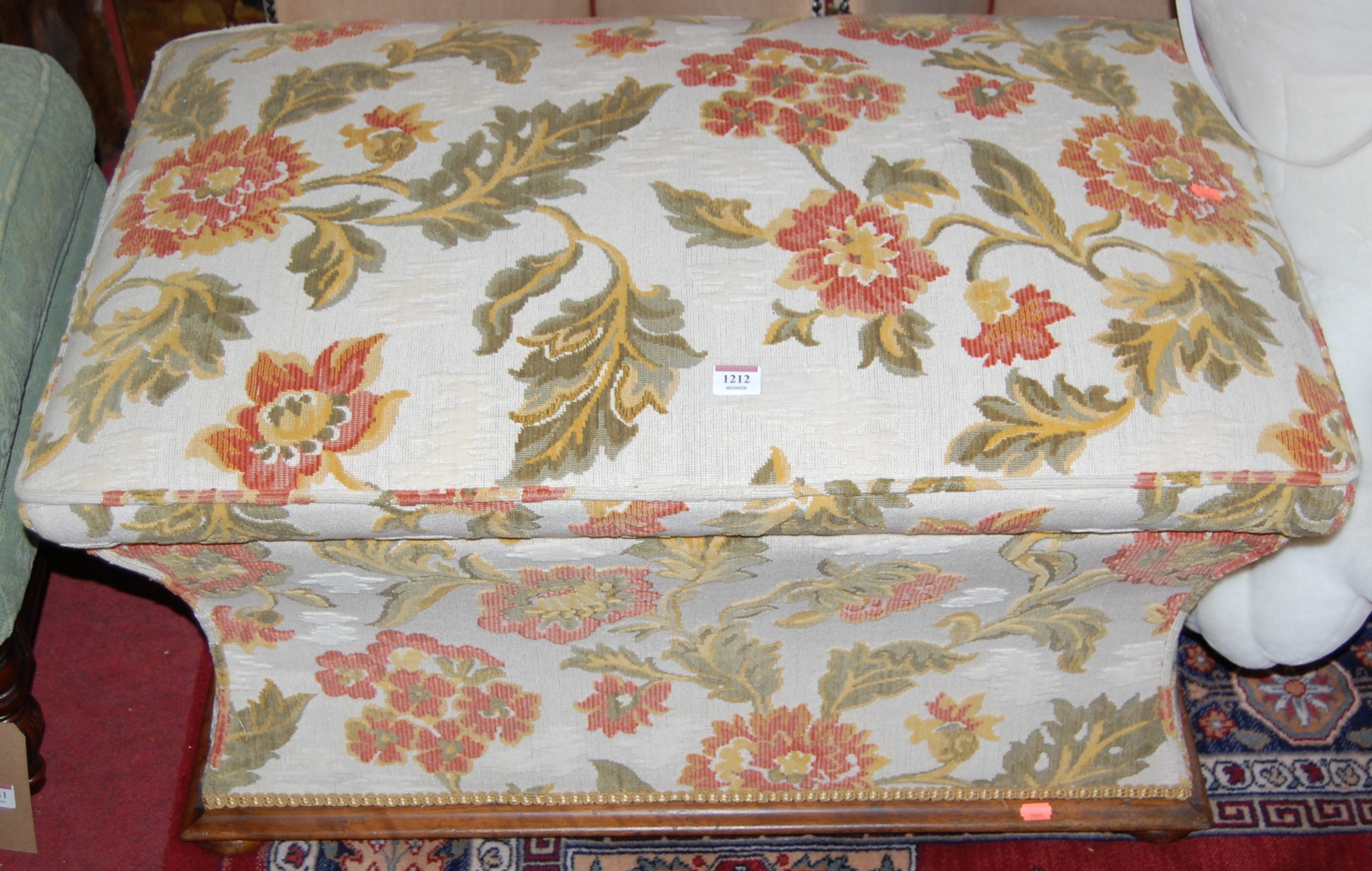 A Victorian mahogany and later floral upholstered hinge top ottoman of waisted form, width 89cm
