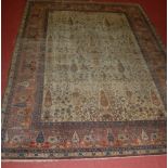 A Persian woollen pale ground rug, continuously decorated with trees (worn), 270 x 190cm