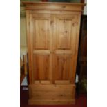 A modern pine double door wardrobe having single long lower drawer, width 102.5cm