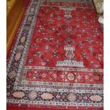 A contemporary Persian style machine woven red ground rug, 290 x 200cm