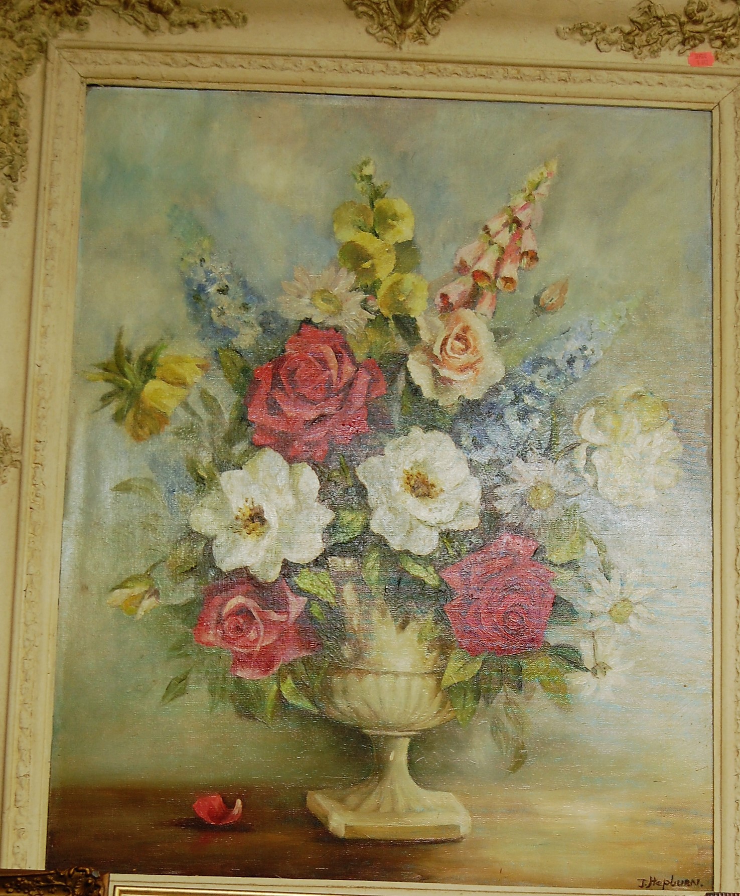 J Hepburn - Still life with cabbage-roses in a pedestal vase, oil on canvas laid on board, signed