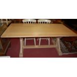 A contemporary limed oak plank topped X-frame refectory dining table, length 200cm
