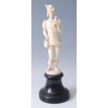 A 19th century carved ivory figure possibly of the Happy Prince, having jewelled tunic and with bird