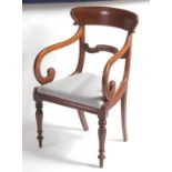 An early Victorian mahogany barback elbow chair, having a moulded centre rail, drop-in seat, and