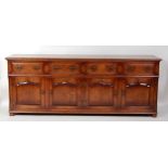 A joined oak dresser base, in the 18th century North Country style, the two-piece top having a