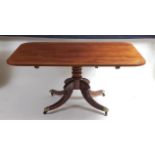 A Regency mahogany pedestal breakfast table, the fiddle back and crossbanded tilt-top having rounded