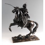 A large circa 1900 bronze modelled as a Cossack on rearing horse with sword raised in right hand,