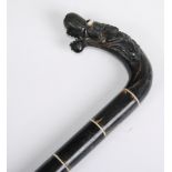 A 19th century Chinese sectional horn and bone dragon head walking cane, length 91cm.Condition