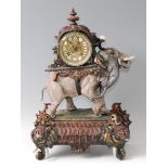 A late 19th century French gilt and bronzed spelter mantel clock, the ornate case modelled as an