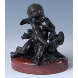 After Claude Michel Clodion - a late 19th century French bronze figural group of Cupid and a Dove,