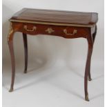 A French Napoleon III rosewood and brass mounted bureau plat, of small proportions, having a gilt