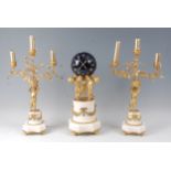 A 19th century French gilt bronze and white marble clock garniture, the clock modelled as three