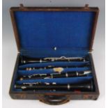 A pair of Boosey & Co Ltd rosewood two piece clarinets, each having matching serial numbers on