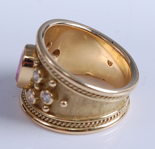 A 1970s 18ct yellow gold, pink sapphire and diamond Etruscan style dress ring by Elizabeth Gage, - Image 2 of 7