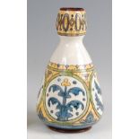 Carlo Manzoni (Italian 1855-1910) - an art pottery vase, underglaze painted in tones of blue, yellow