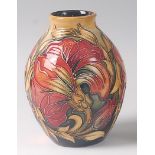 A modern Moorcroft pottery vase in the Spanish pattern, of ovoid form, printed backstamp, painted