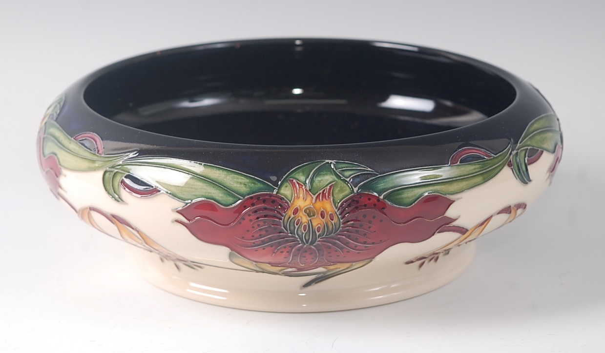 A modern Moorcroft pottery bowl in the Anna Lily pattern, designed by Nicola Slaney, of squat