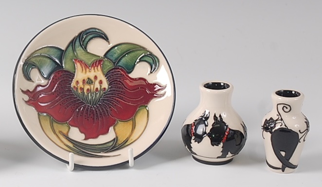 A modern Moorcroft pottery circular pin tray in the Anna Lily pattern, impressed backstamp,