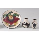A modern Moorcroft pottery circular pin tray in the Anna Lily pattern, impressed backstamp,