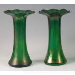 A pair of early 20th century Loetz style iridescent green glass vases, each having flattened wavy