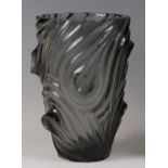 A mid-20th century French heavy moulded smoked art glass vase, having all-over trailing thumb