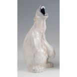 Royal Copenhagen - a porcelain model of a Polar Bear, in seated roaring pose, printed backstamp