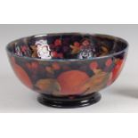 A circa 1930s Moorcroft pottery circular fruit bowl in the Pomegranate pattern, underglaze painted