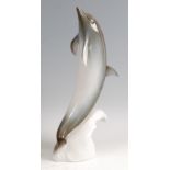 Royal Dux - a large porcelain model of a Dolphin, modelled on the crest of a wave, underglaze