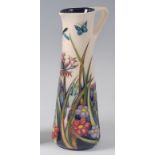 A modern Moorcroft pottery ewer in the Walnut Tree Meadow pattern, designed by Rachel Bishop, of