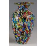 A 1960s Murano 'Tutti Frutti' baluster glass vase, having a flattened rim, decorated with all-over