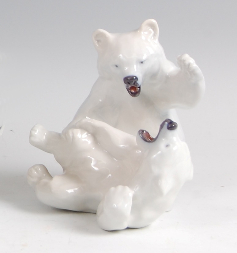 Royal Copenhagen - a glazed porcelain figure of two Polar Bears, in playful pose, printed